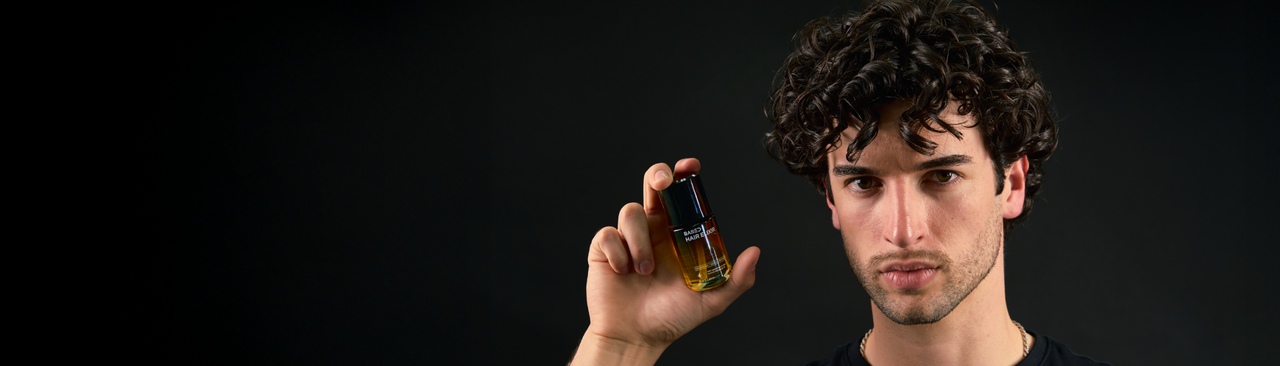 Holding BASED Hair Elixir
